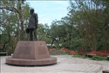 George Herman Statue with damage in the background